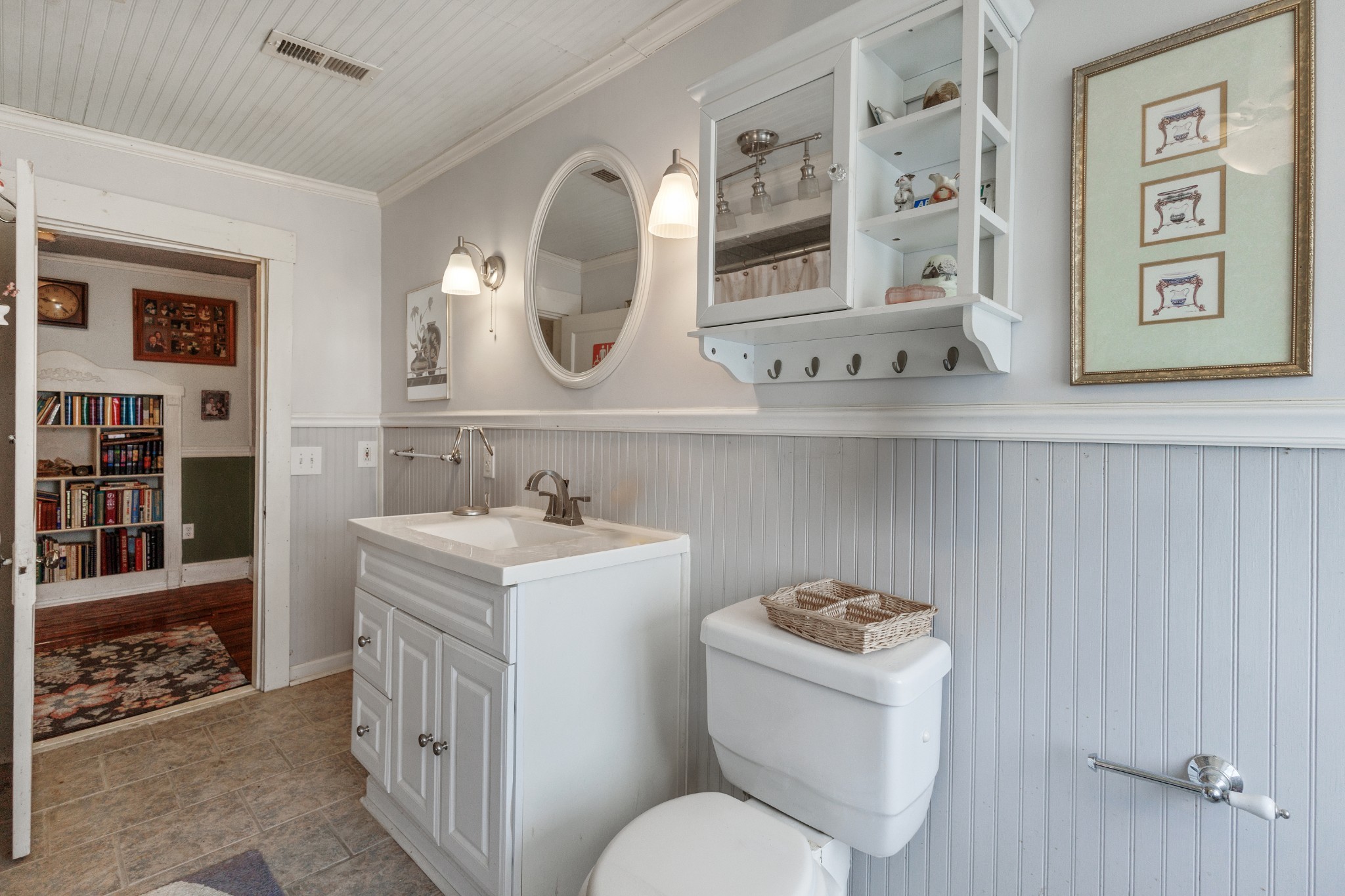 3371 Highway 76 Cottontown, TN 37048 - Photo 35 of 54 a bathroom with a toilet a sink and mirror