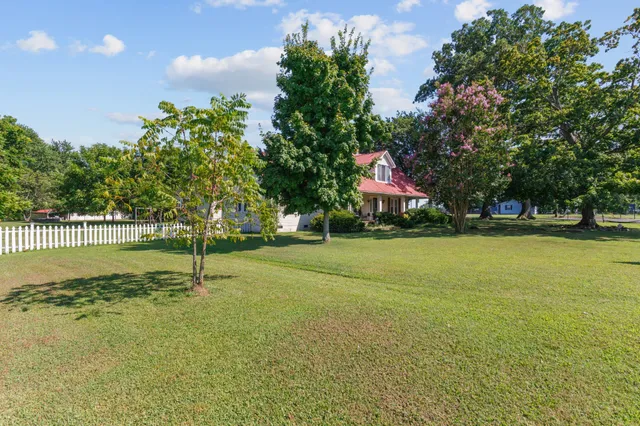 a view of a backyard with jacuzzi