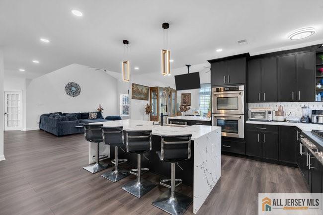 43 Meadow Run Road Bordentown, NJ 08505 - Photo 18 of 52 a kitchen with stainless steel appliances kitchen island granite countertop a table chairs sink and cabinets