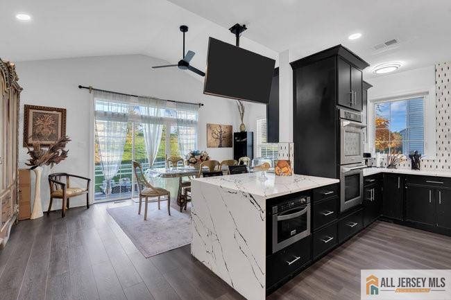 43 Meadow Run Road Bordentown, NJ 08505 - Photo 23 of 52 a open kitchen with stainless steel appliances granite countertop a lot of counter space and wooden floors