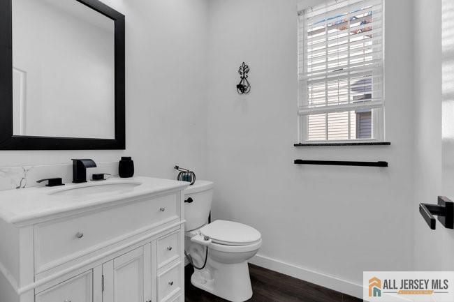 43 Meadow Run Road Bordentown, NJ 08505 - Photo 3 of 52 a bathroom with a toilet a sink a mirror and a window