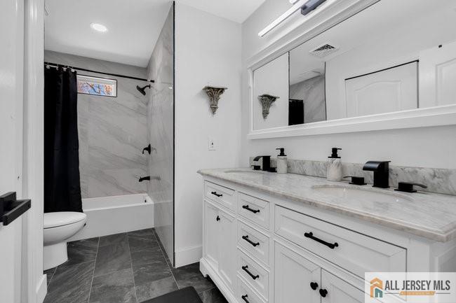 43 Meadow Run Road Bordentown, NJ 08505 - Photo 32 of 52 a bathroom with a granite countertop sink a toilet and a tub