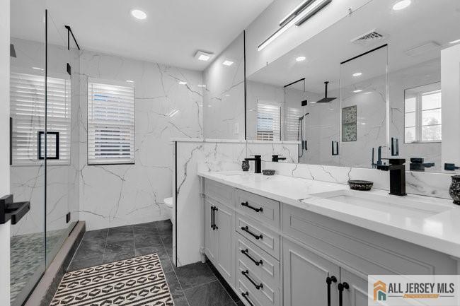 43 Meadow Run Road Bordentown, NJ 08505 - Photo 38 of 52 a bathroom with a double vanity sink a mirror and a shower