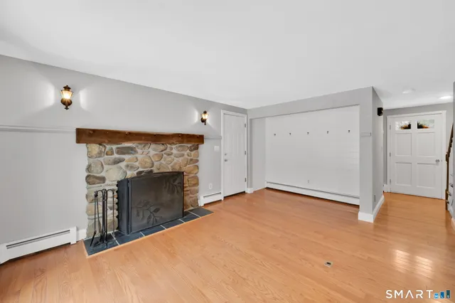 a view of an empty room with a fireplace