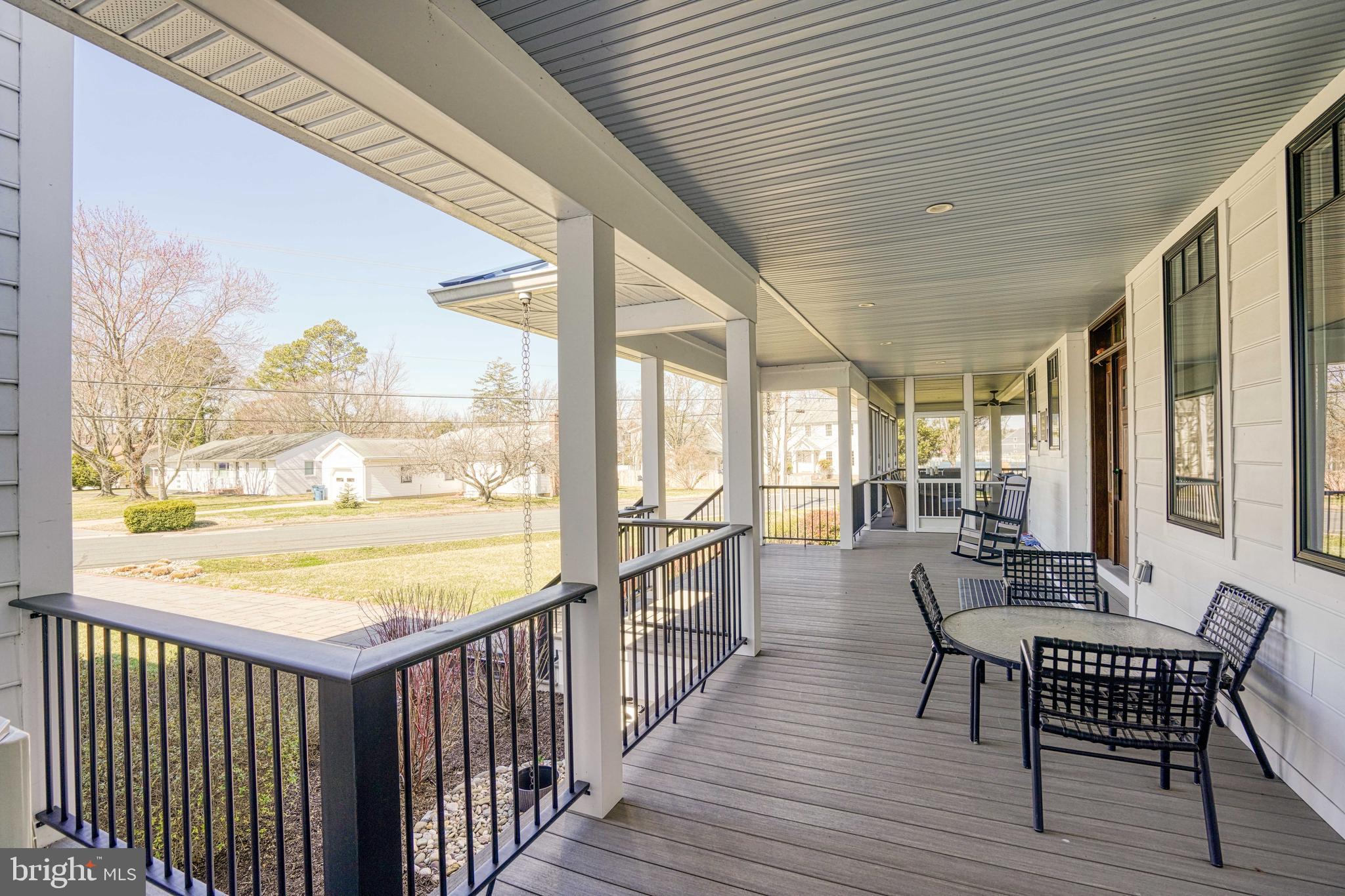 303 Manor Street St. Michaels, MD 21663 - Photo 14 of 100 a view of a large room with wooden floor and outdoor space