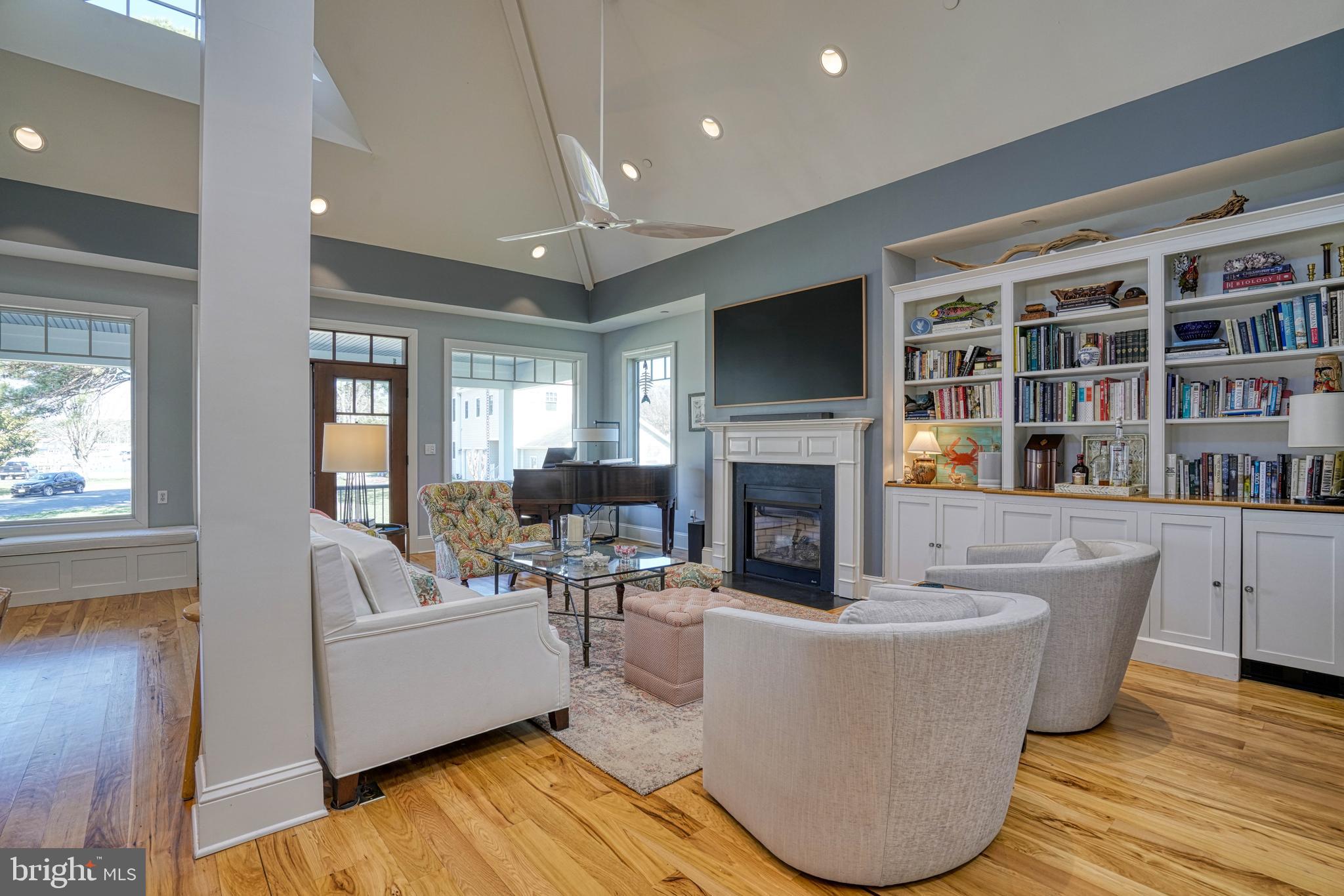 303 Manor Street St. Michaels, MD 21663 - Photo 21 of 100 a living room with fireplace furniture and a flat screen tv