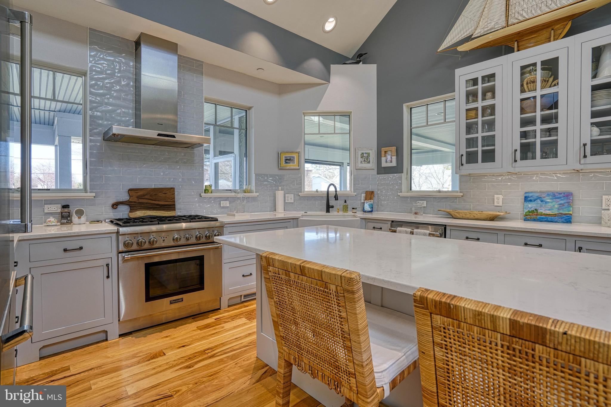 303 Manor Street St. Michaels, MD 21663 - Photo 35 of 100 a kitchen with stainless steel appliances granite countertop a stove a sink and a microwave