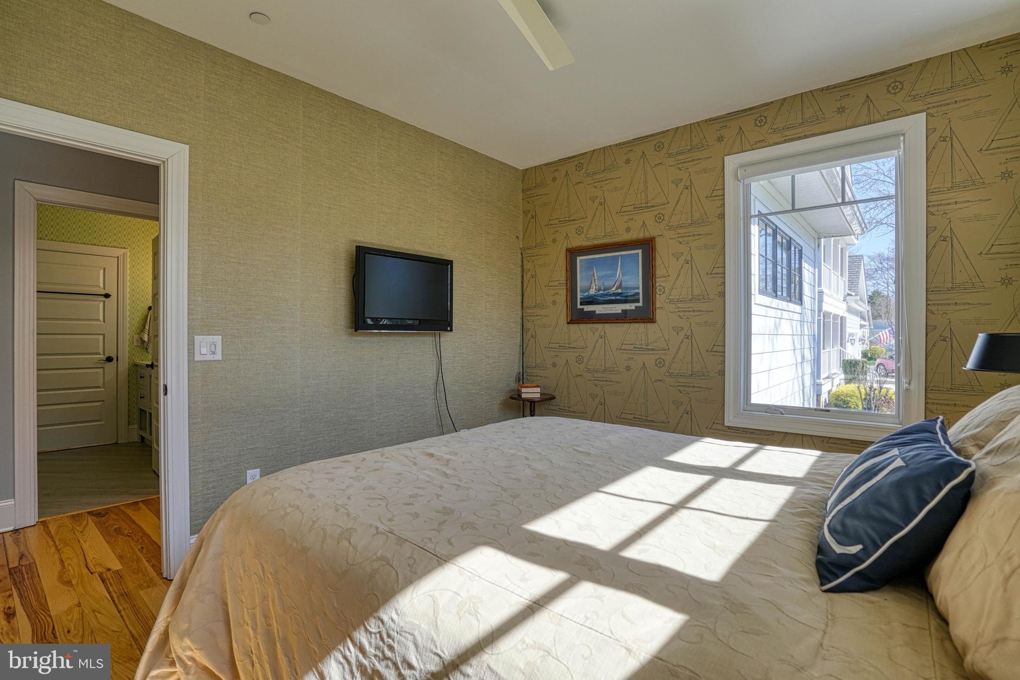 303 Manor Street St. Michaels, MD 21663 - Photo 61 of 100 a bedroom with a bed and a window