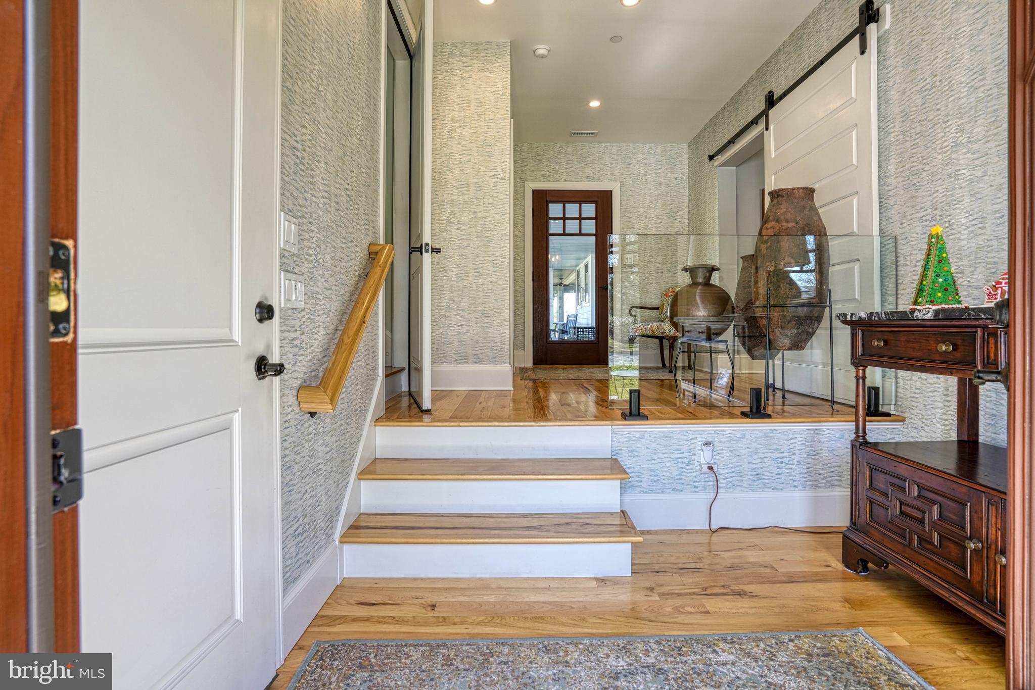 303 Manor Street St. Michaels, MD 21663 - Photo 66 of 100 a view of staircase with white walls and a rug