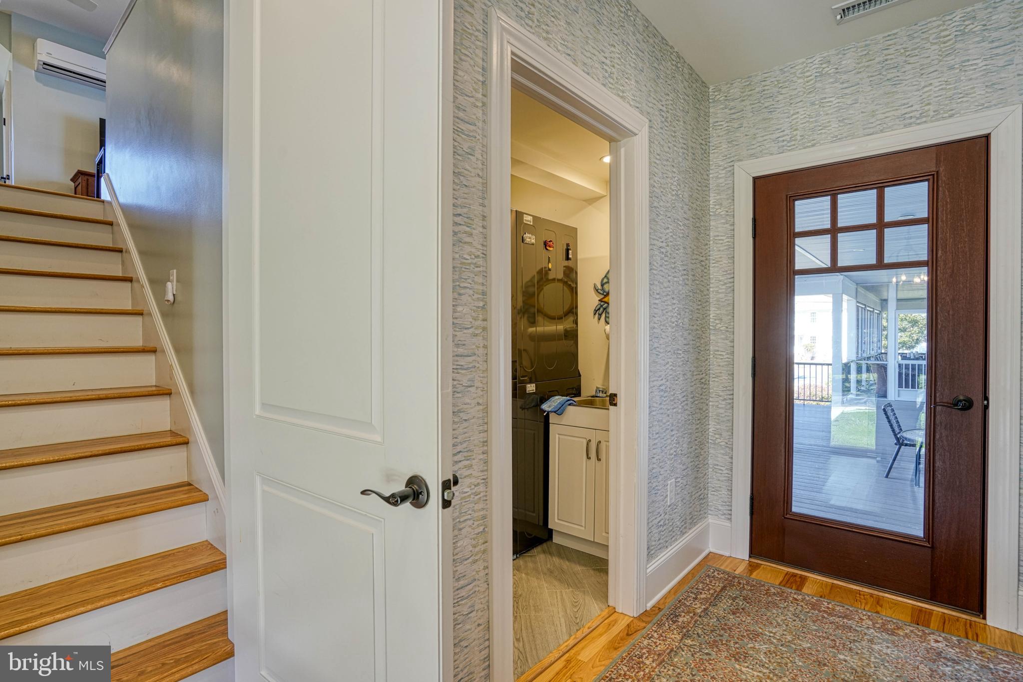 303 Manor Street St. Michaels, MD 21663 - Photo 70 of 100 a view of a hallway with wooden floor and entryway