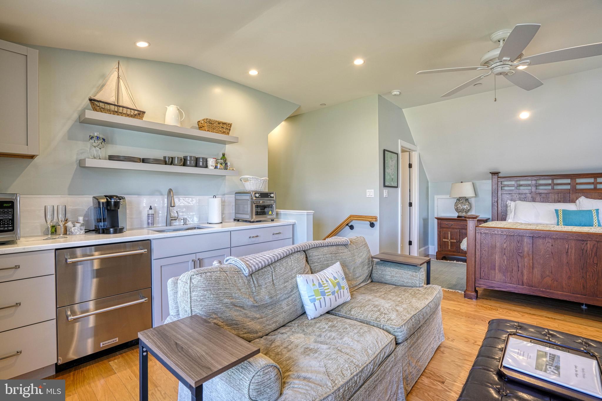303 Manor Street St. Michaels, MD 21663 - Photo 77 of 100 a living room with furniture and a kitchen