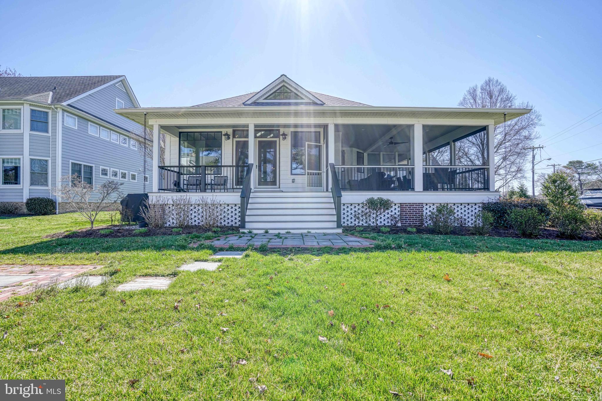 303 Manor Street St. Michaels, MD 21663 - Photo 84 of 100 a front view of a house with a yard