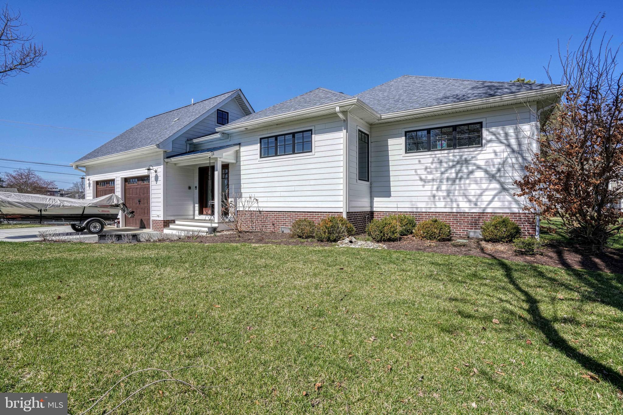 303 Manor Street St. Michaels, MD 21663 - Photo 93 of 100 a front view of a house with garden