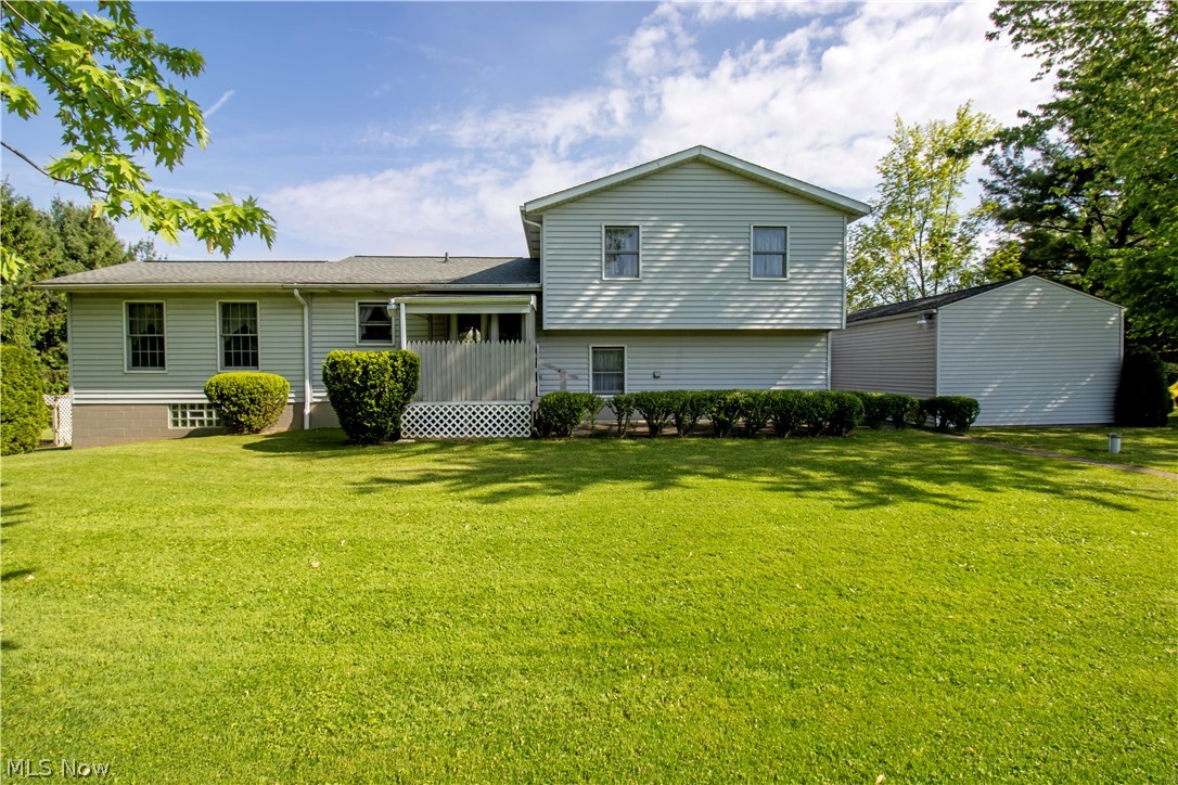 9360 Zimmerman Road Wooster, OH 44691 - Photo 24 of 33 Rear view of property featuring a yard