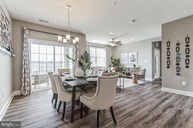 a view of kitchen with cabinets and wooden floor