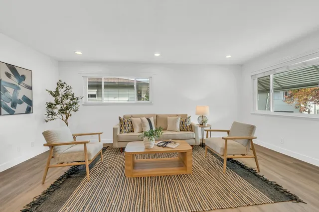 a living room with furniture and a rug