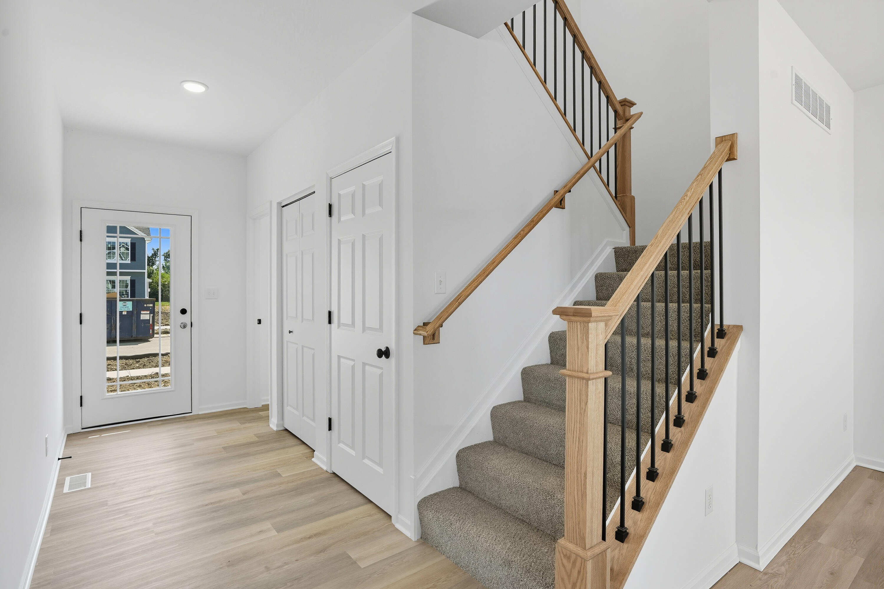 5800 Buck Lane Portage, IN 46368 - Photo 4 of 22 a view of an entryway with wooden floor and stairs