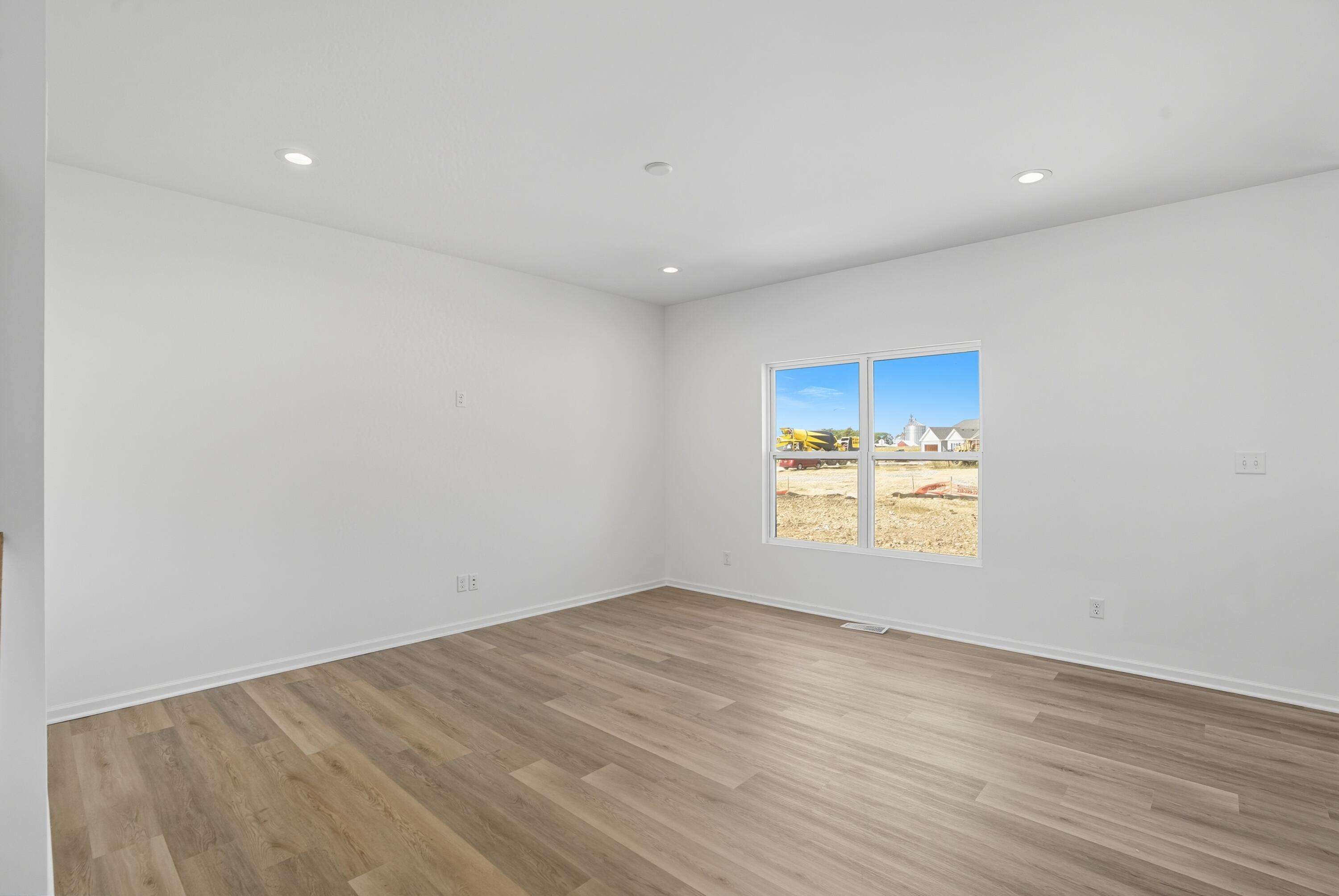 5800 Buck Lane Portage, IN 46368 - Photo 10 of 22 an empty room with wooden floor and windows