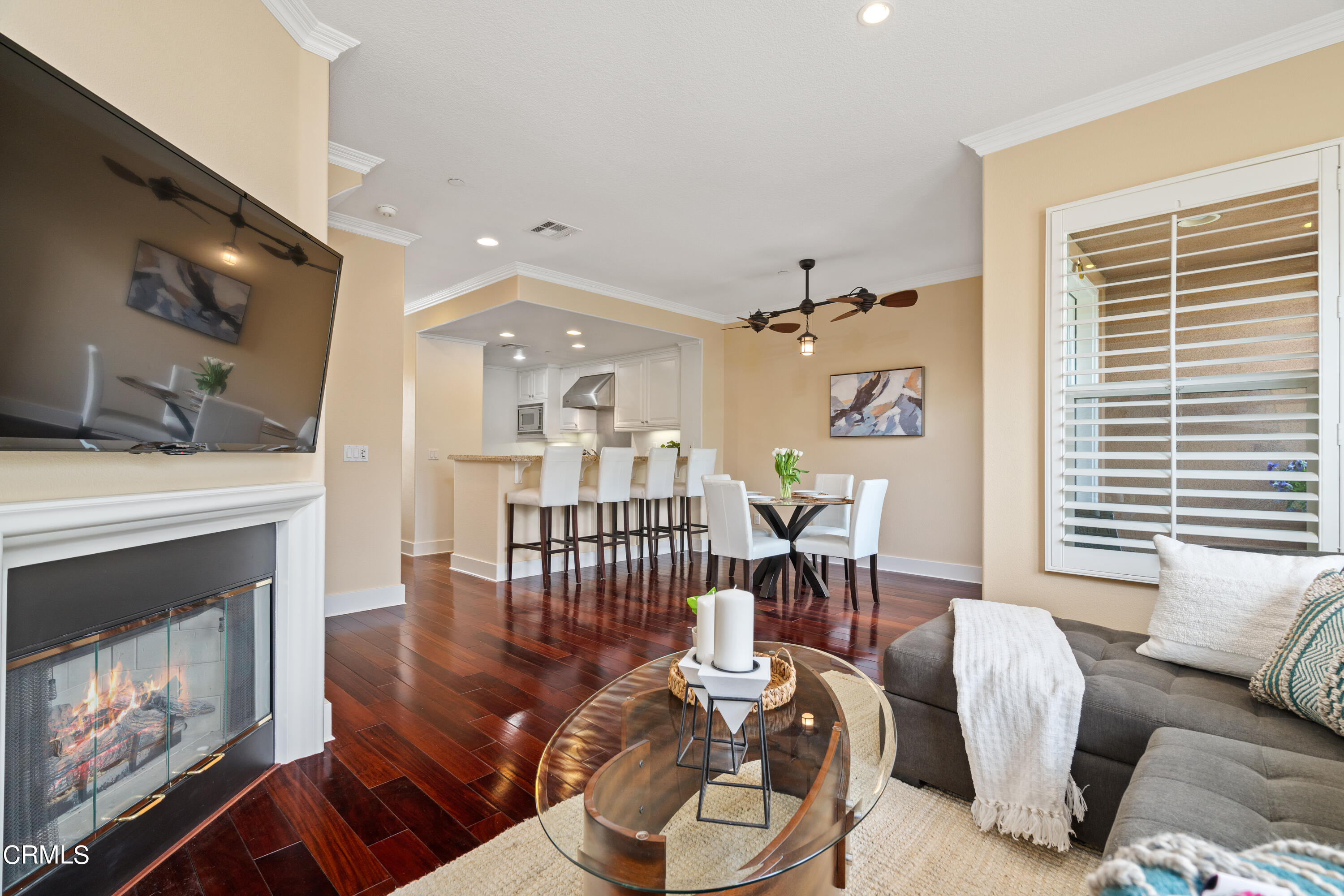 453 North Altadena Drive, Unit 5 Pasadena, CA 91107 - Photo 11 of 36 a living room with furniture a fireplace and a large window