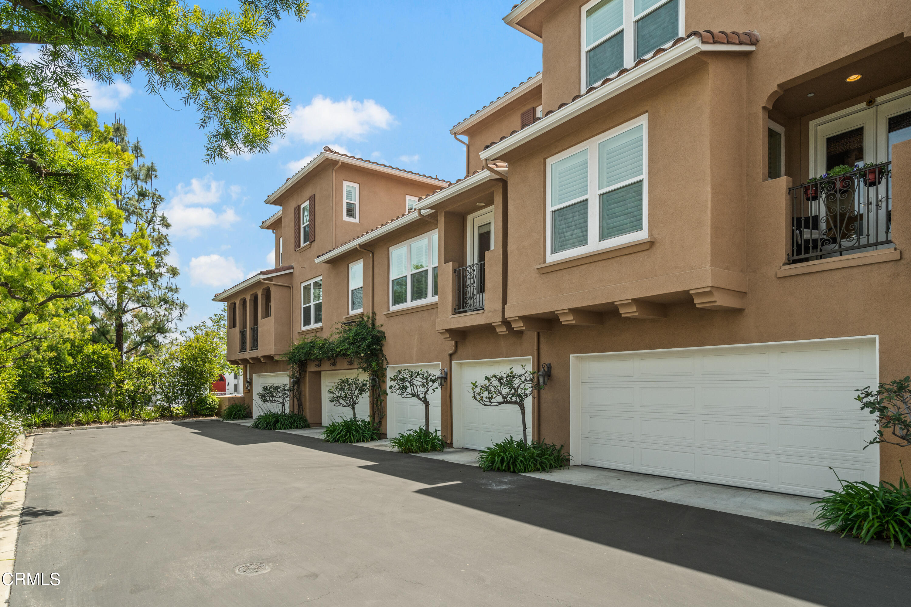 453 North Altadena Drive, Unit 5 Pasadena, CA 91107 - Photo 34 of 36 a front view of a house with a yard and garage