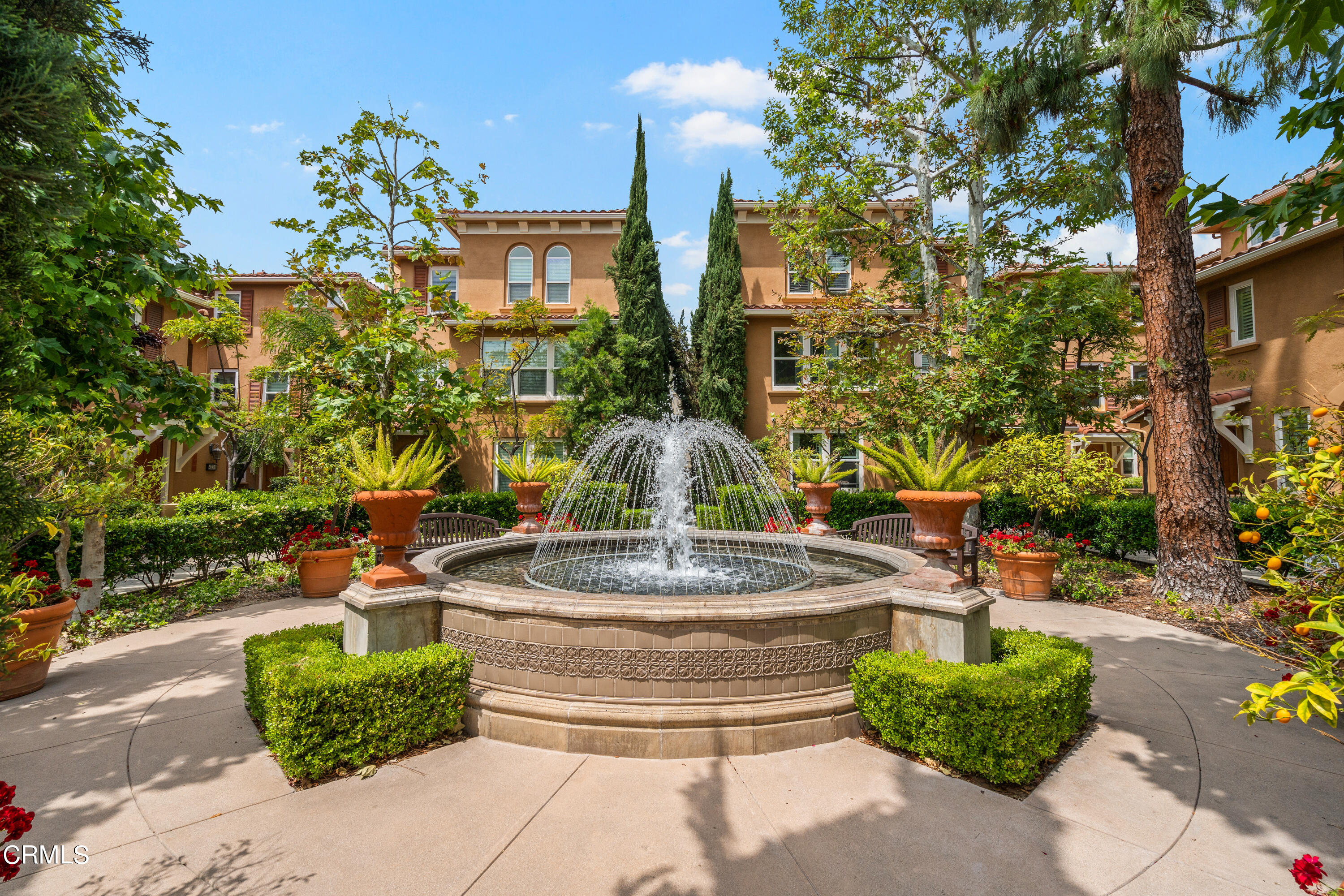 453 North Altadena Drive, Unit 5 Pasadena, CA 91107 - Photo 4 of 36 a tall yellow building with trees in front of it