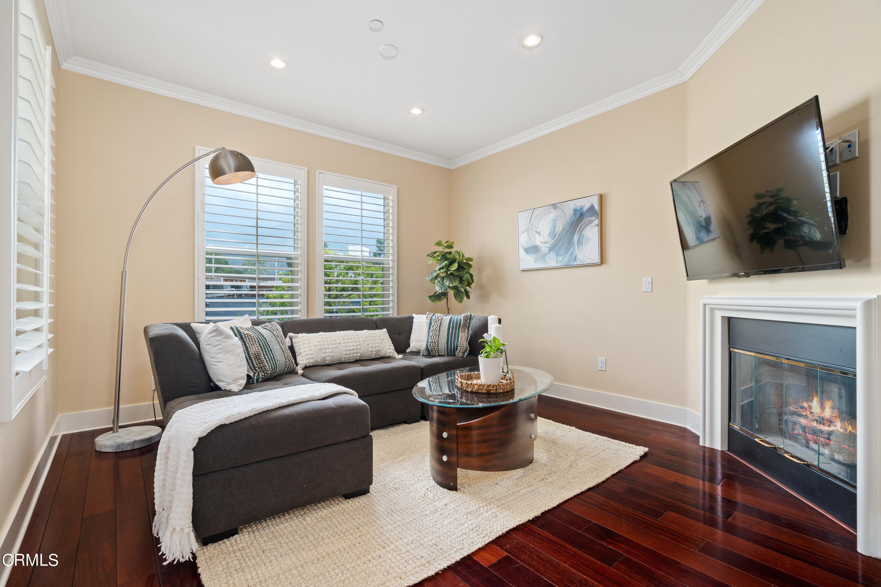 453 North Altadena Drive, Unit 5 Pasadena, CA 91107 - Photo 10 of 36 a living room with furniture a flat screen tv and a fireplace