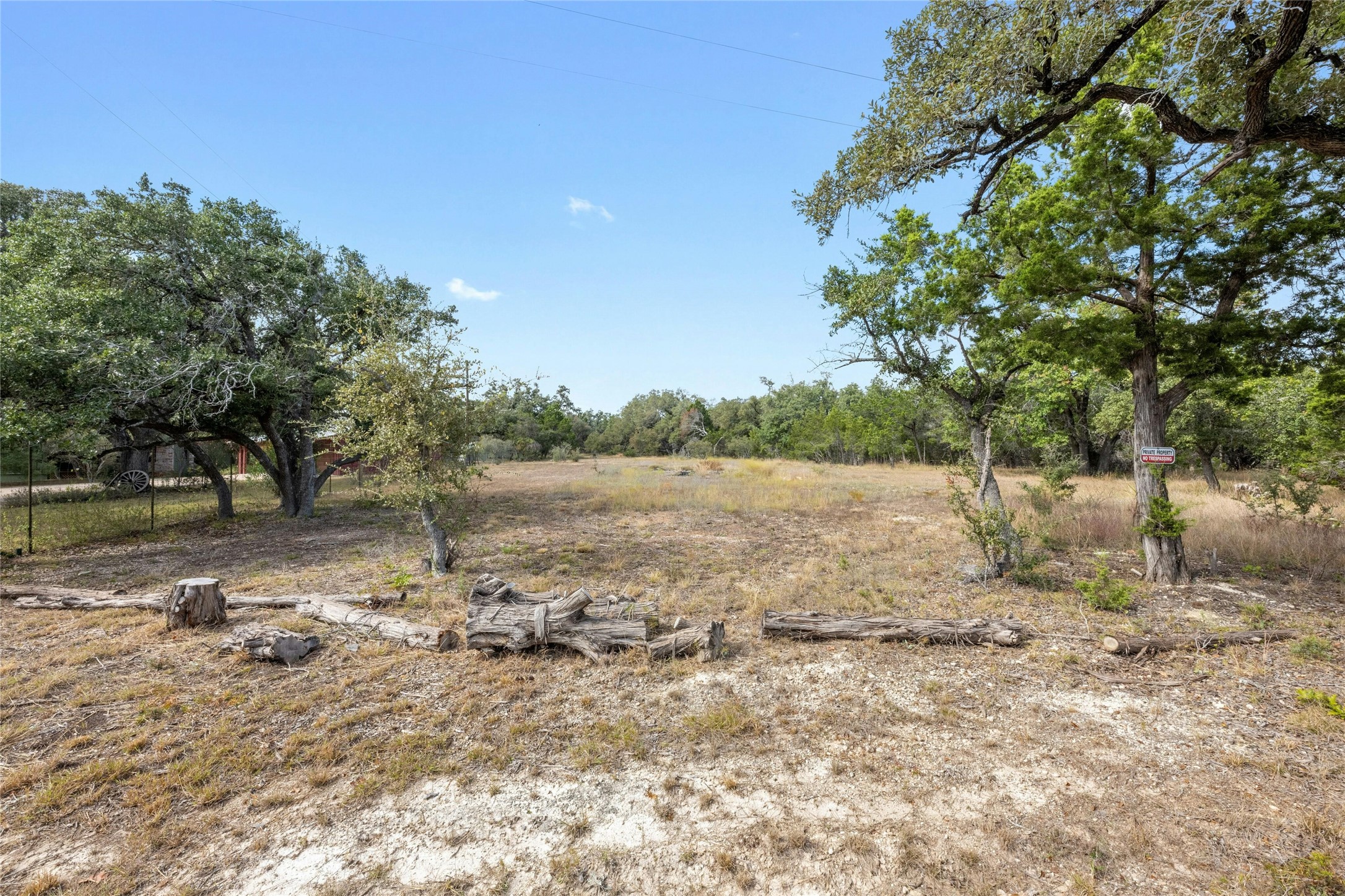 200 Ted Burger Road Dripping Springs, TX 78620 - Photo 2 of 11 a view of a yard with wooden fence
