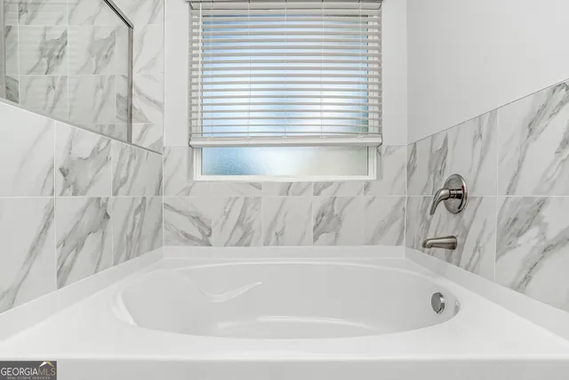 a bathroom with a bathtub