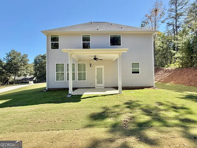 a view of a yard in front of a house with a yard