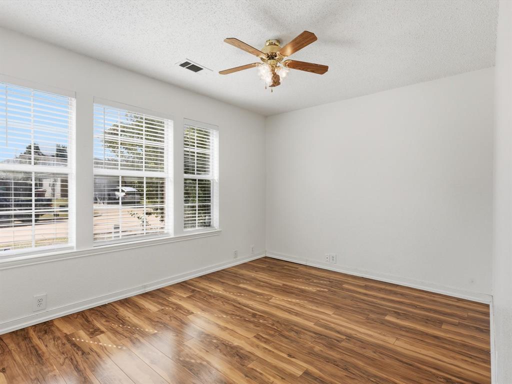 4305 Falcon Drive Sherman, TX 75092 - Photo 16 of 27 a view of a big room with wooden floor and a window