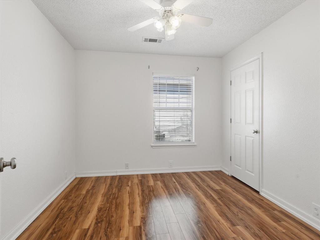 4305 Falcon Drive Sherman, TX 75092 - Photo 17 of 27 wooden floor in an empty room with a window