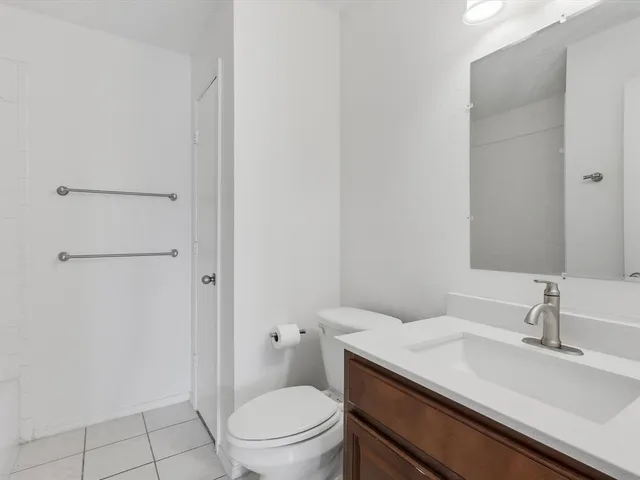 a bathroom with a sink toilet and vanity
