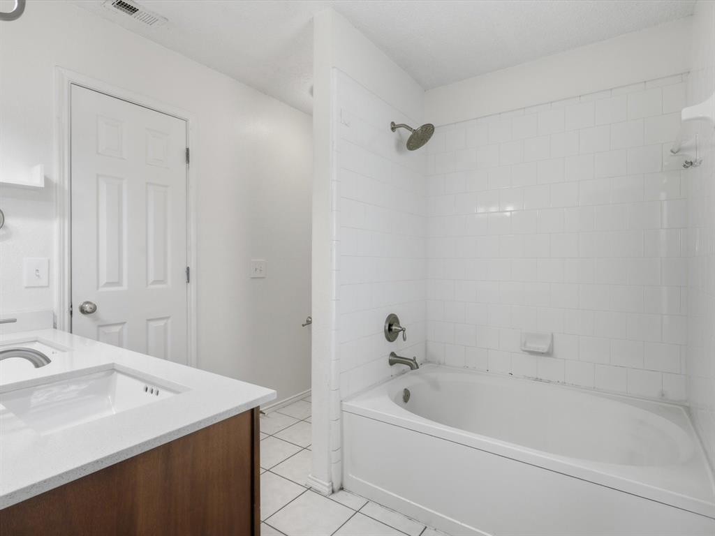 4305 Falcon Drive Sherman, TX 75092 - Photo 21 of 27 a bath room with a sink and a bath tub