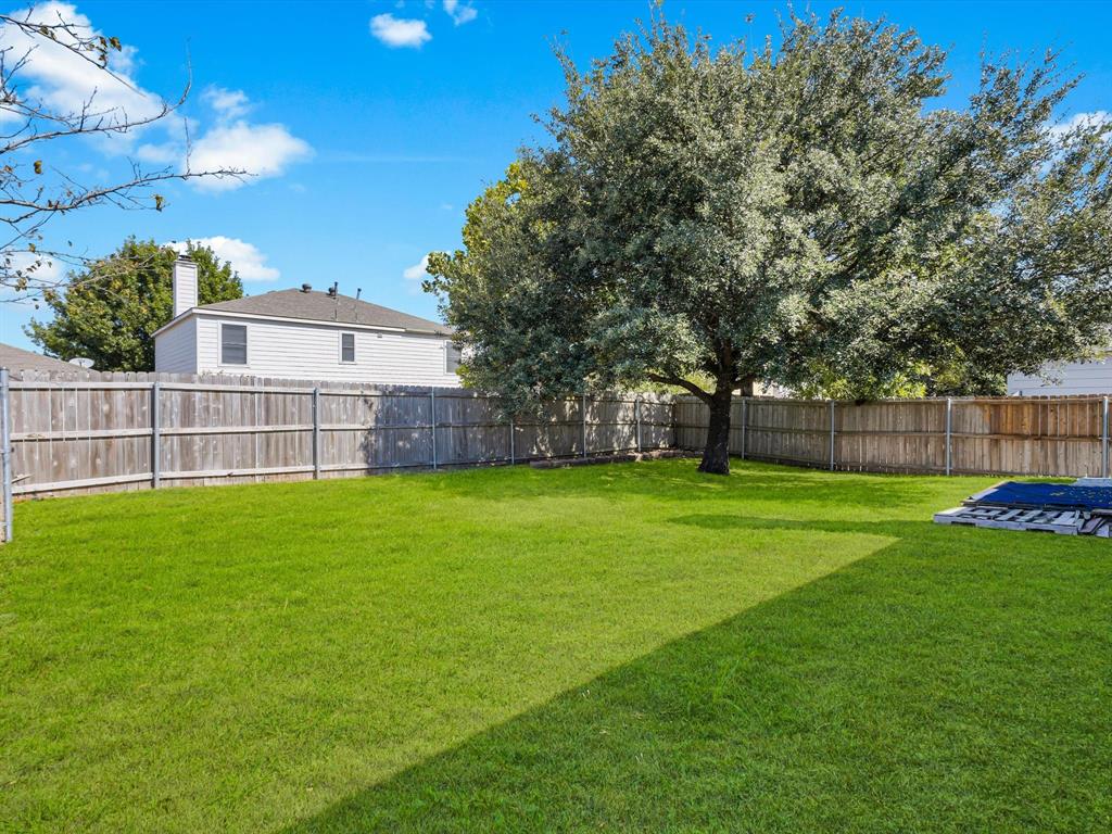 4305 Falcon Drive Sherman, TX 75092 - Photo 25 of 27 a view of a backyard with a garden and entertaining space