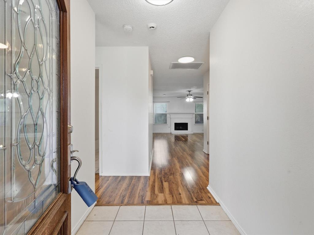 4305 Falcon Drive Sherman, TX 75092 - Photo 5 of 27 a view of a bathroom from a corridor