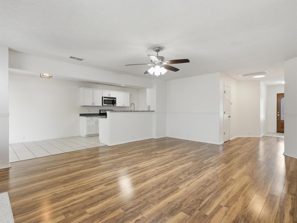 4305 Falcon Drive Sherman, TX 75092 - Photo 10 of 27 a view of a kitchen with a sink and a refrigerator