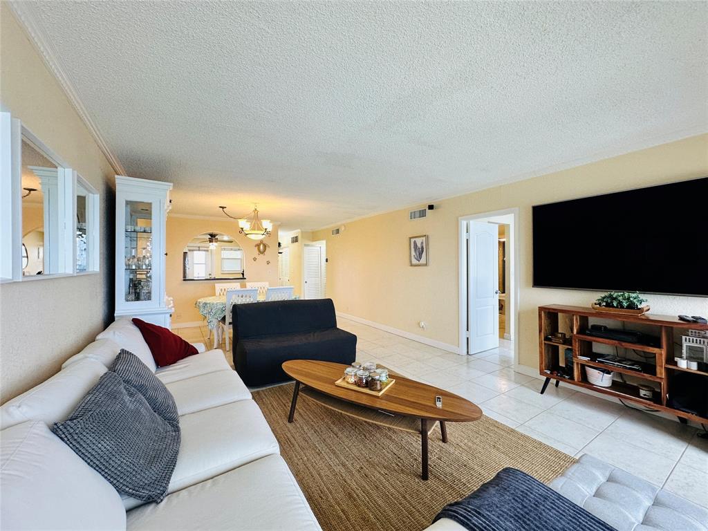 750 North Ocean Boulevard, Unit 2008 Pompano Beach, FL 33062 - Photo 13 of 64 a living room with furniture and a flat screen tv