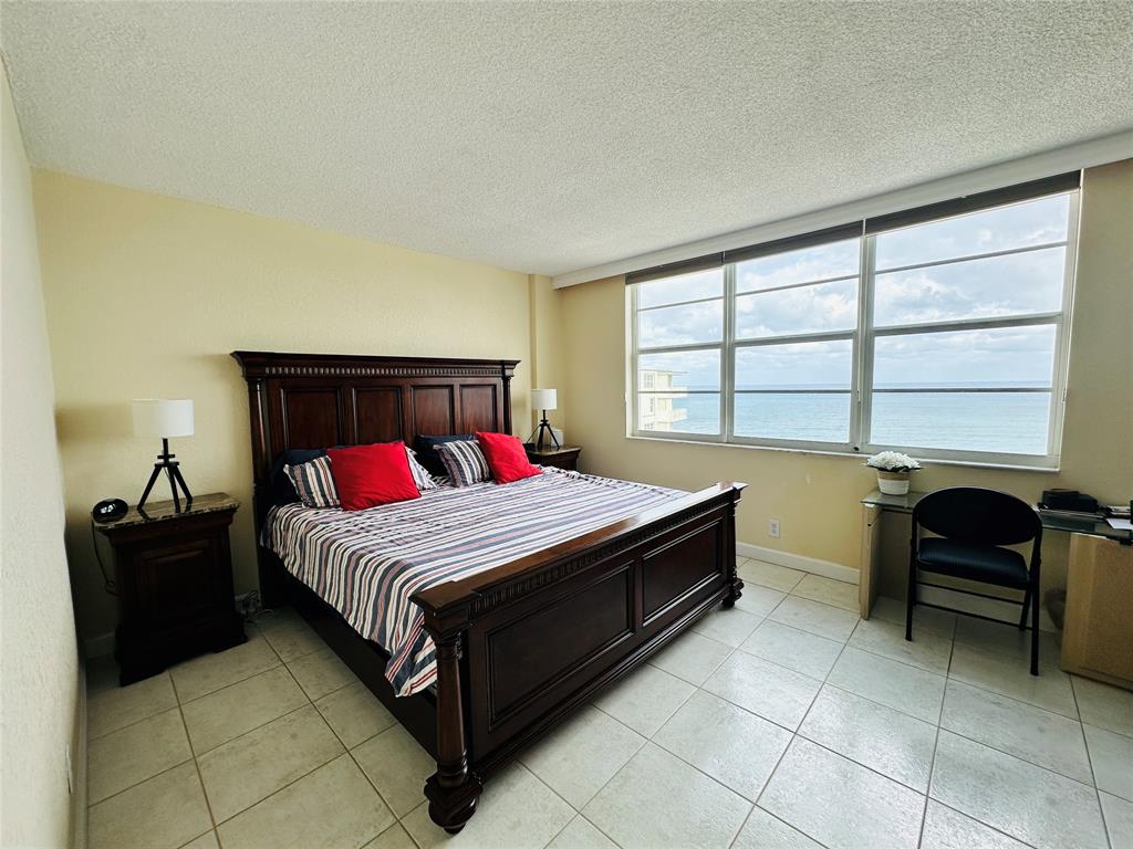 750 North Ocean Boulevard, Unit 2008 Pompano Beach, FL 33062 - Photo 21 of 64 a bedroom with a bed and a window