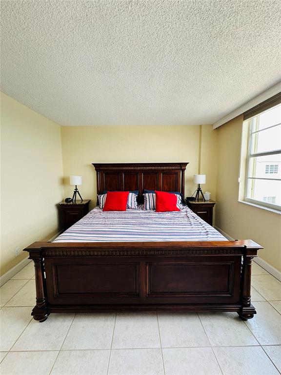 750 North Ocean Boulevard, Unit 2008 Pompano Beach, FL 33062 - Photo 22 of 64 a bedroom with a bed and window