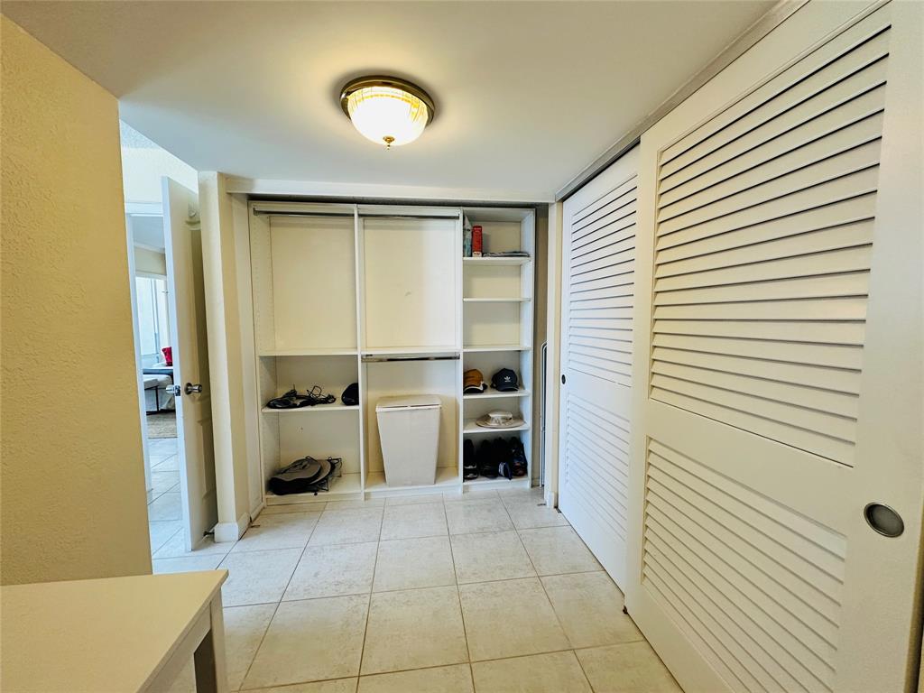 750 North Ocean Boulevard, Unit 2008 Pompano Beach, FL 33062 - Photo 24 of 64 a room with a chair and appliances