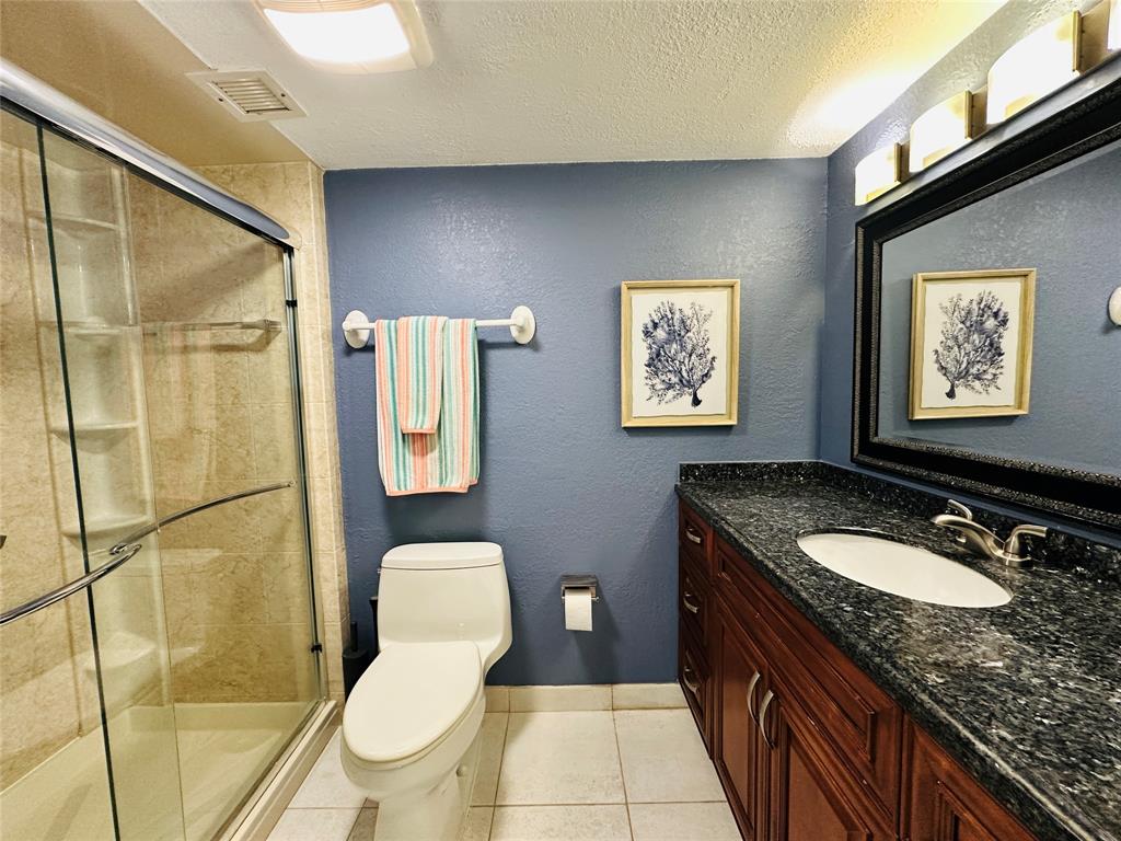 750 North Ocean Boulevard, Unit 2008 Pompano Beach, FL 33062 - Photo 27 of 64 a bathroom with a granite countertop toilet sink and mirror