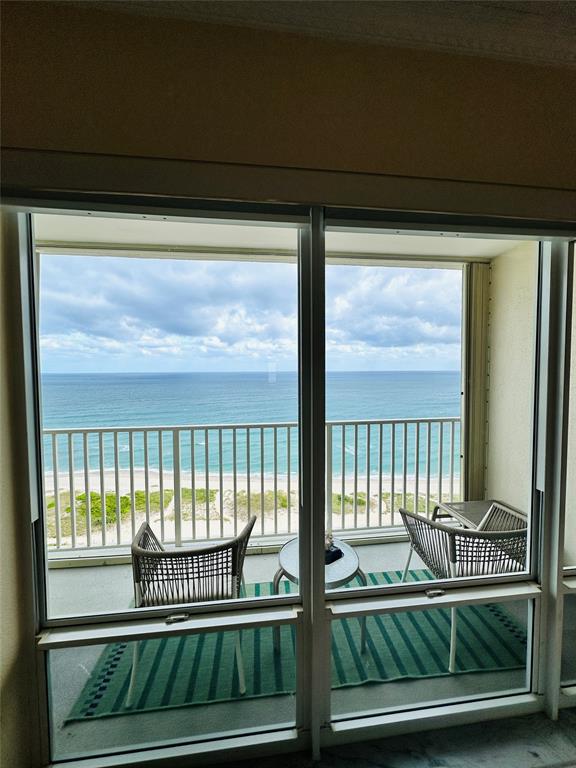 750 North Ocean Boulevard, Unit 2008 Pompano Beach, FL 33062 - Photo 3 of 64 a view of a porch with a floor to ceiling window