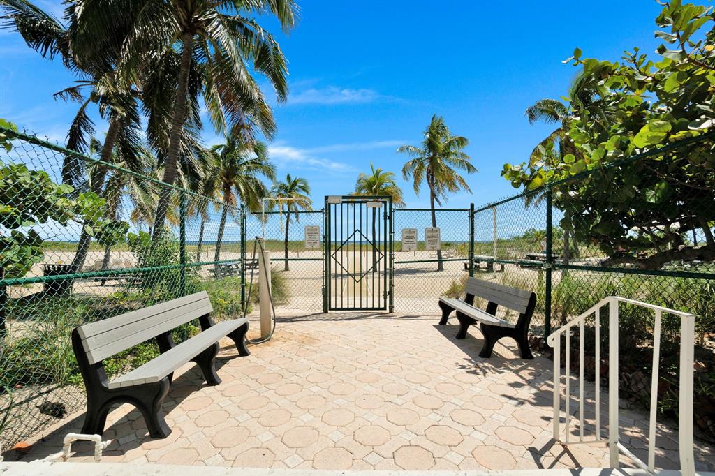 750 North Ocean Boulevard, Unit 2008 Pompano Beach, FL 33062 - Photo 63 of 64 a view of outdoor space with seating area and trees