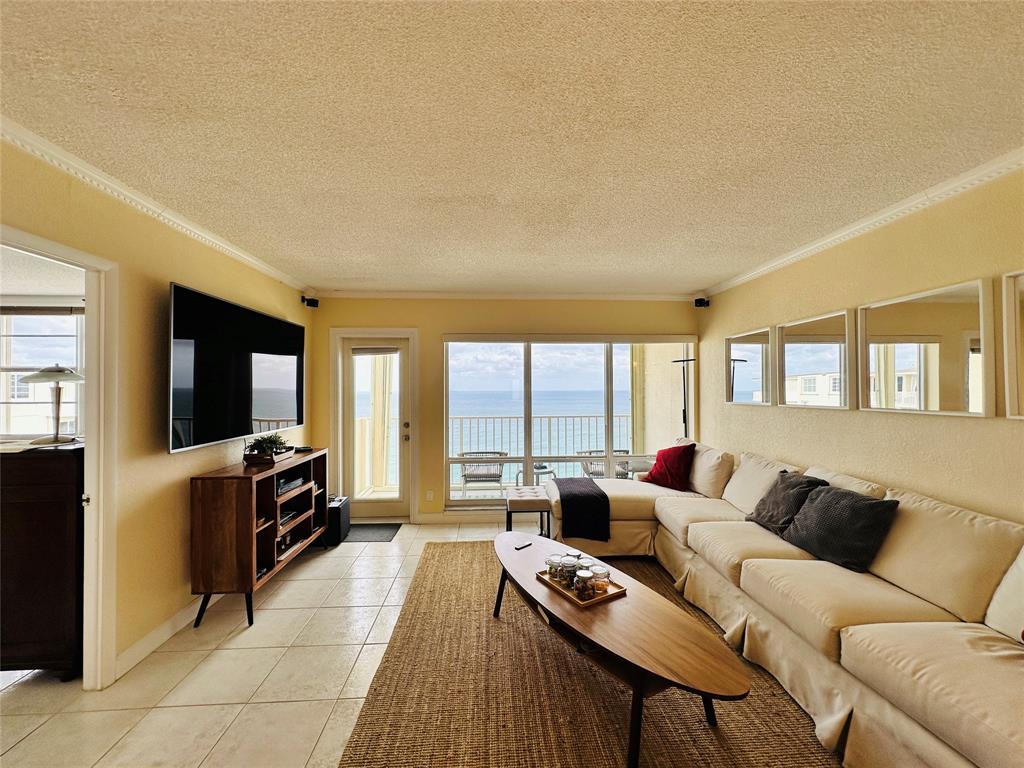 750 North Ocean Boulevard, Unit 2008 Pompano Beach, FL 33062 - Photo 8 of 64 a living room with furniture and a flat screen tv