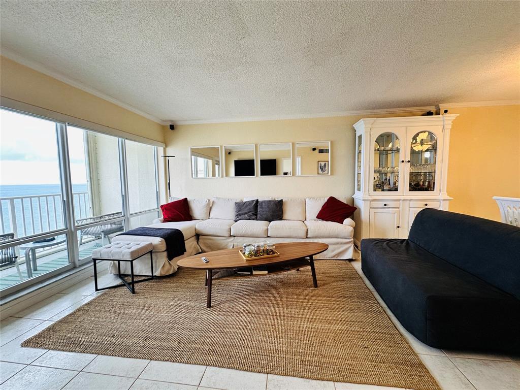 750 North Ocean Boulevard, Unit 2008 Pompano Beach, FL 33062 - Photo 10 of 64 a living room with furniture potted plant and a large window