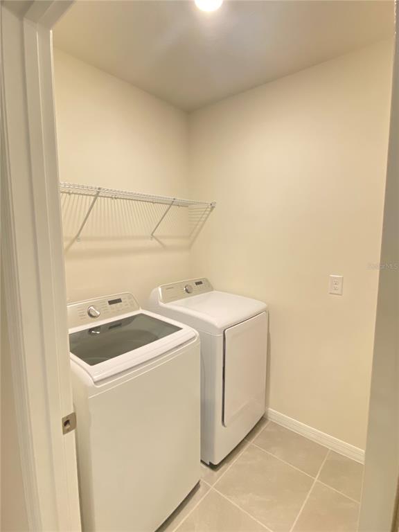 556 Talisi Loop St. Cloud, FL 34771 - Photo 11 of 16 a utility room with dryer and washer