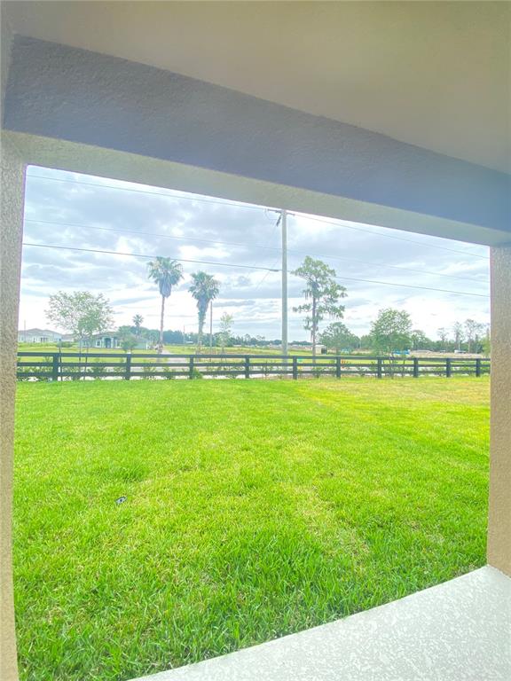 556 Talisi Loop St. Cloud, FL 34771 - Photo 15 of 16 a view of green field with grass