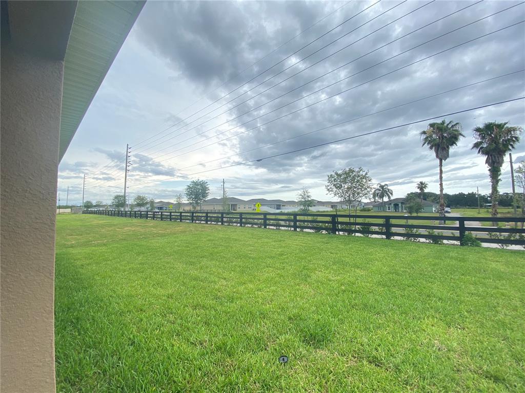 556 Talisi Loop St. Cloud, FL 34771 - Photo 16 of 16 a view of a golf course with a lake view