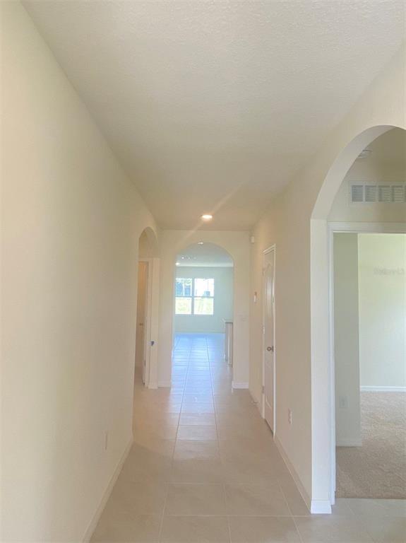 556 Talisi Loop St. Cloud, FL 34771 - Photo 2 of 16 a view of a hallway