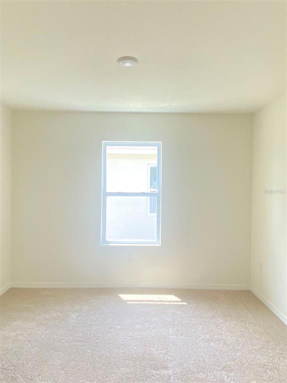 556 Talisi Loop St. Cloud, FL 34771 - Photo 5 of 16 an empty room with a window